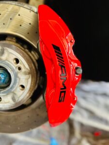 Freshly painted red brake calipers on a Mercedes AMG GT53, customized by Rims and Calipers Paint in Atlanta, GA.