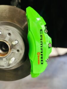 Chevrolet Camaro with newly painted Lime Green brake calipers at Rims and Calipers Paint in Atlanta