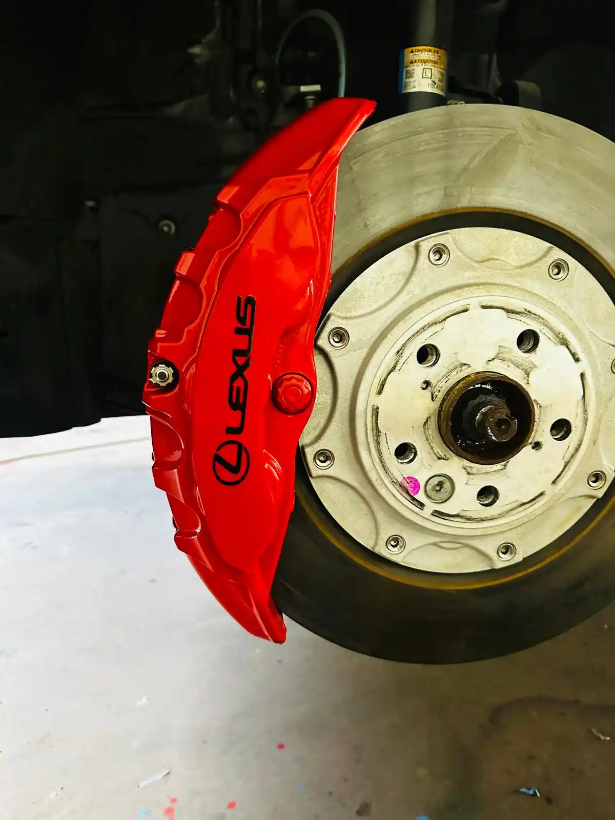 lexus rx500h f sport red caliper lexus logo closeup atlanta